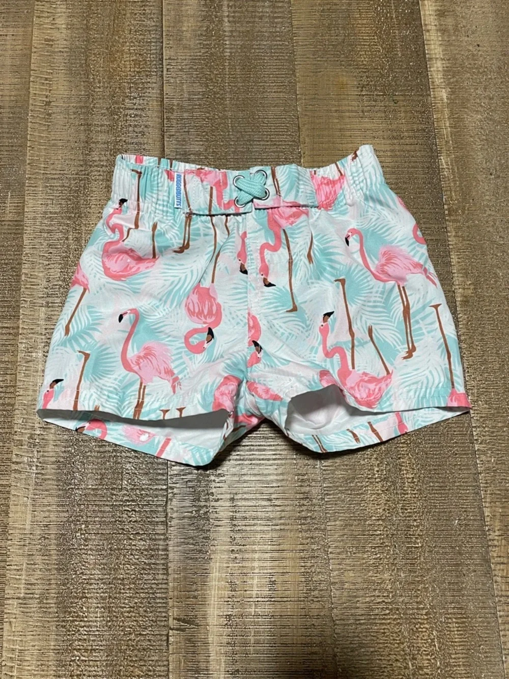 Rugged Butts Baby Swim Trunks with Flamingo Print